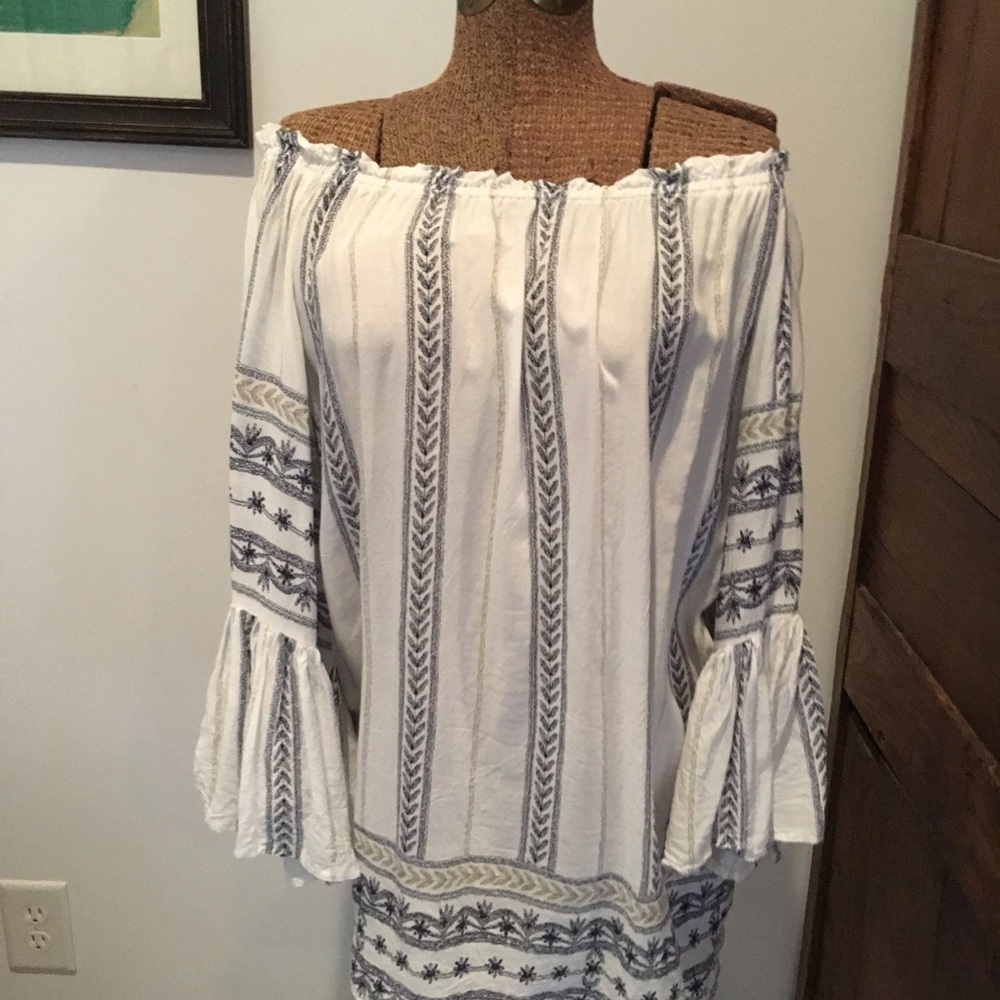 White cotton peasant top with blue print stripes.